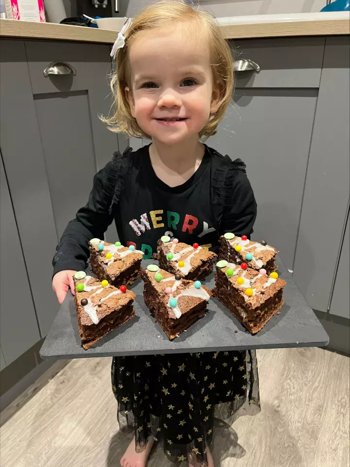 Imogen with Christmas tree gluten free brownies 